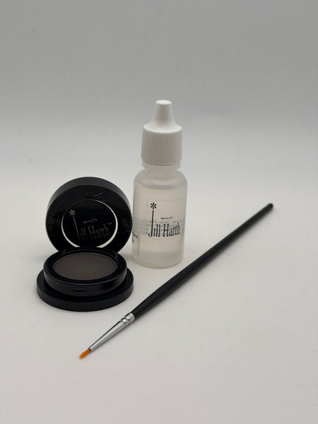 Charcoal Cake Eyeliner comes with a Thin Liner Brush and Sealer solution
