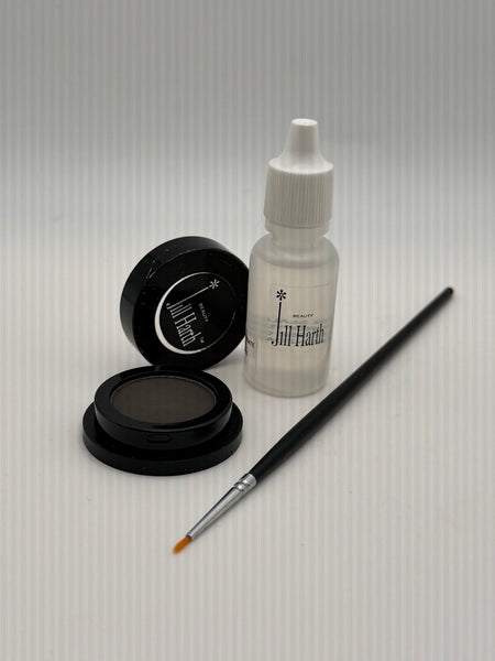 Charcoal Cake Eyeliner comes with a Thin Liner Brush and Sealer solution